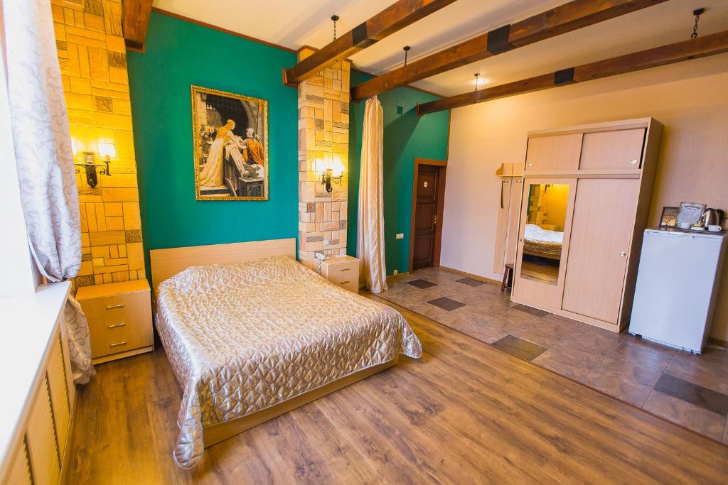 クルガンにあるAivengoの緑の壁、ベッド付きのベッドルーム1室
