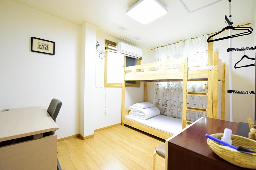 Postel nebo postele na pokoji v ubytování Ganderak Guesthouse