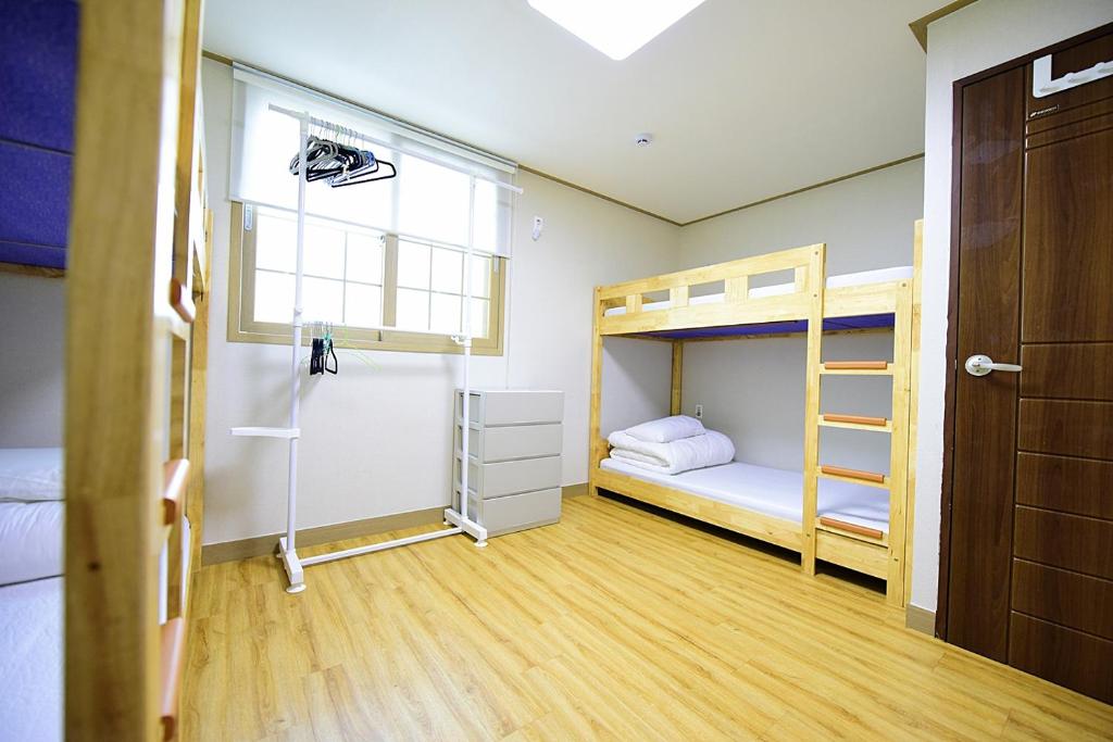 Postel nebo postele na pokoji v ubytování Ganderak Guesthouse