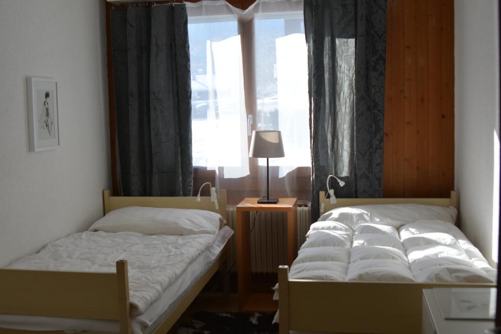 Postel nebo postele na pokoji v ubytování Apartment Champéry Grand Pré A