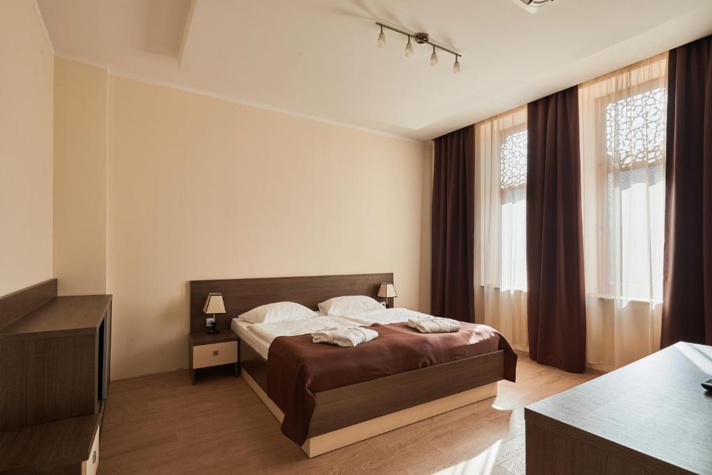 Postel nebo postele na pokoji v ubytování Hotel Gino Wellness Rabath