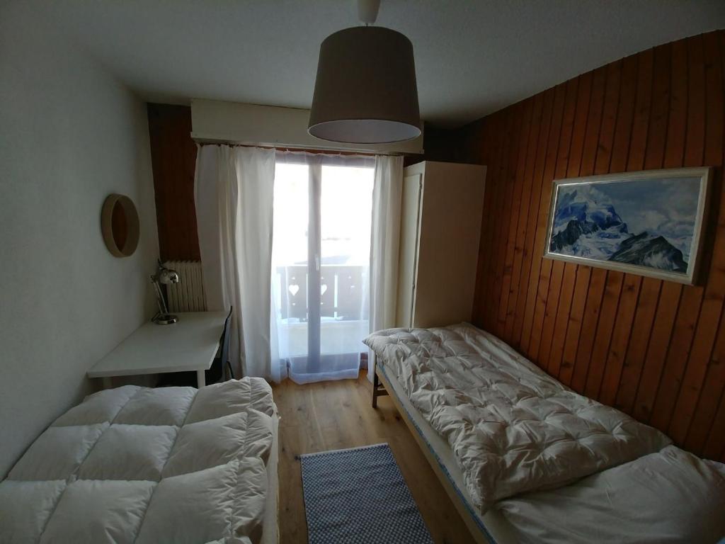 Postel nebo postele na pokoji v ubytování Apartment Champéry Grand Pré A
