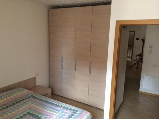 Łóżko lub łóżka w pokoju w obiekcie Palazzina Rosa
