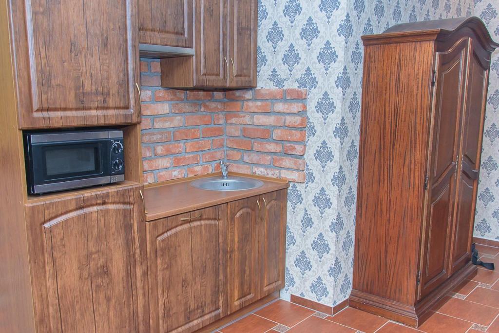 Kuchyň nebo kuchyňský kout v ubytování Hotelik Wulpink Majdy Olsztyn