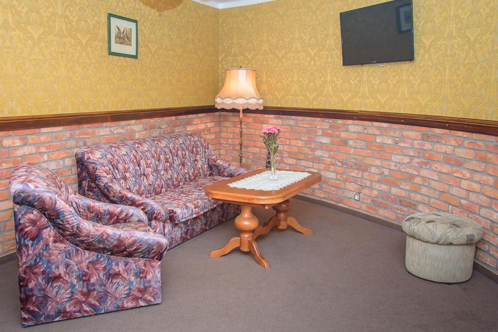 Posezení v ubytování Hotelik Wulpink Majdy Olsztyn