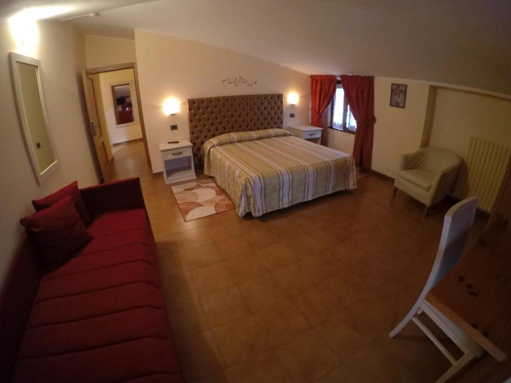 Postel nebo postele na pokoji v ubytování Hotel Ristorante Combolo