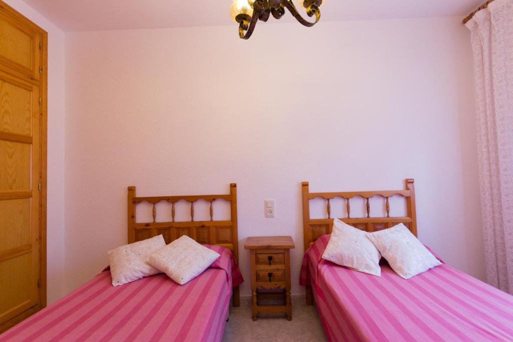 Posteľ alebo postele v izbe v ubytovaní INNOUTHOME Casa Piscina