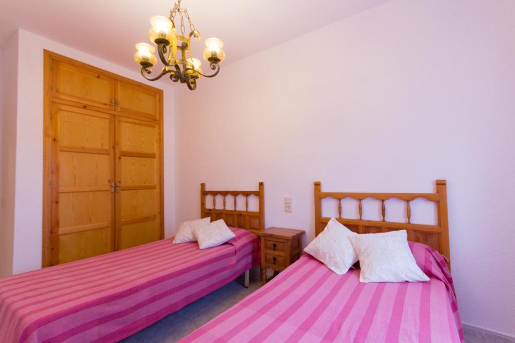 Posteľ alebo postele v izbe v ubytovaní INNOUTHOME Casa Piscina