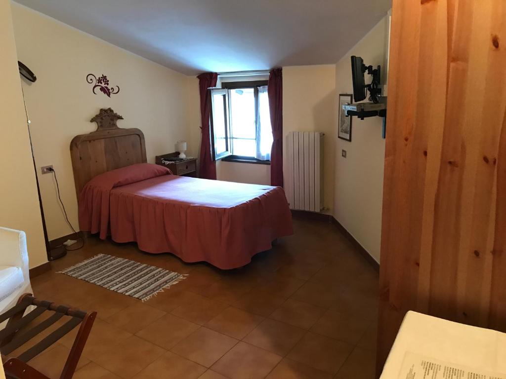 Postel nebo postele na pokoji v ubytování Hotel Ristorante Combolo