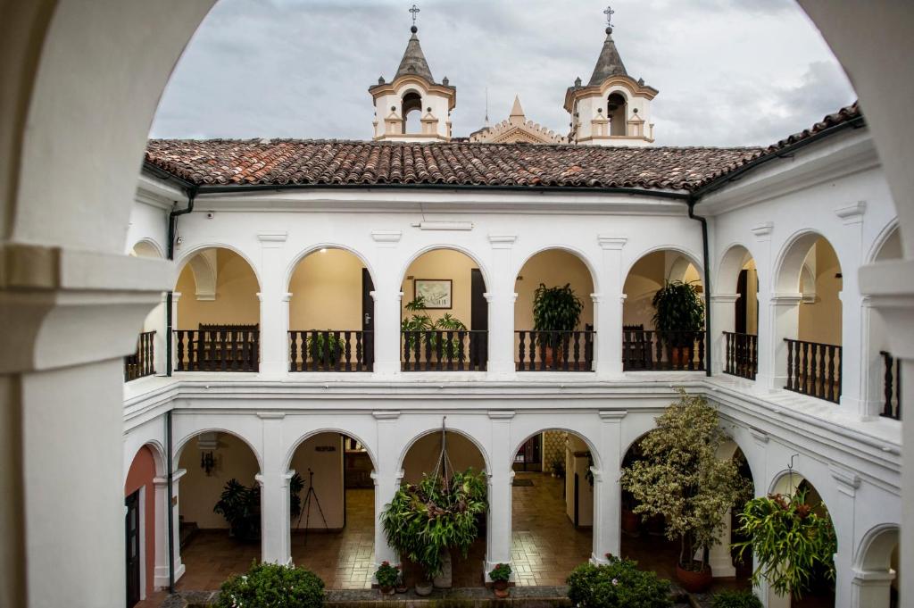 an archway view of the courtyard of a building at Hotel La Plazuela in Popayan