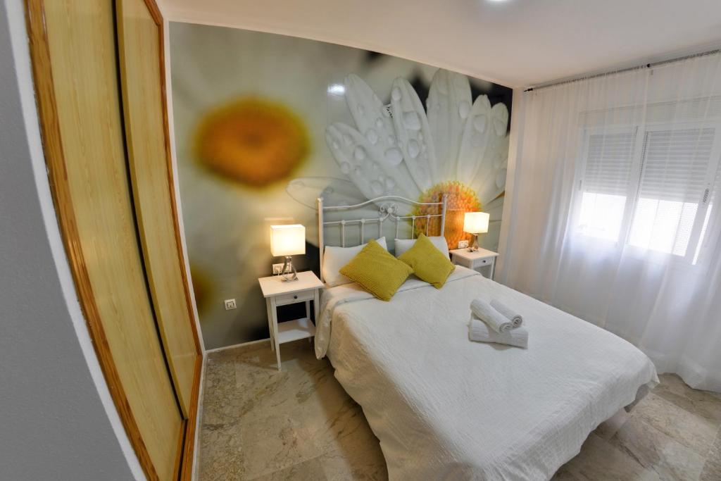 Posteľ alebo postele v izbe v ubytovaní WonderStays Apartamentos Vela