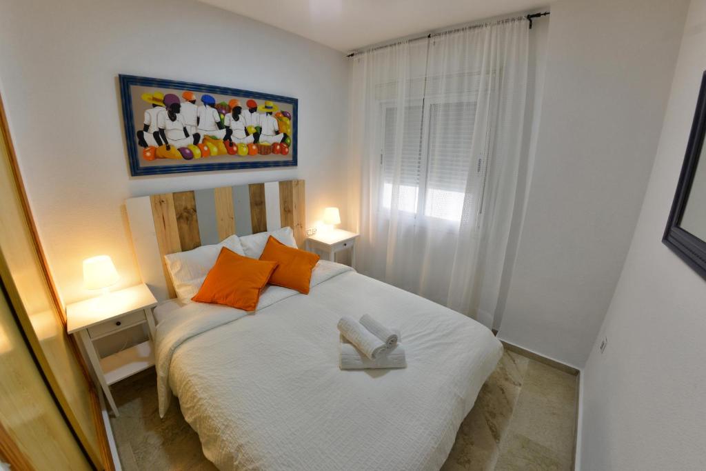 Posteľ alebo postele v izbe v ubytovaní WonderStays Apartamentos Vela