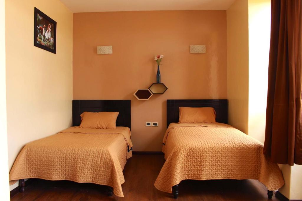 A bed or beds in a room at Hotel Norte