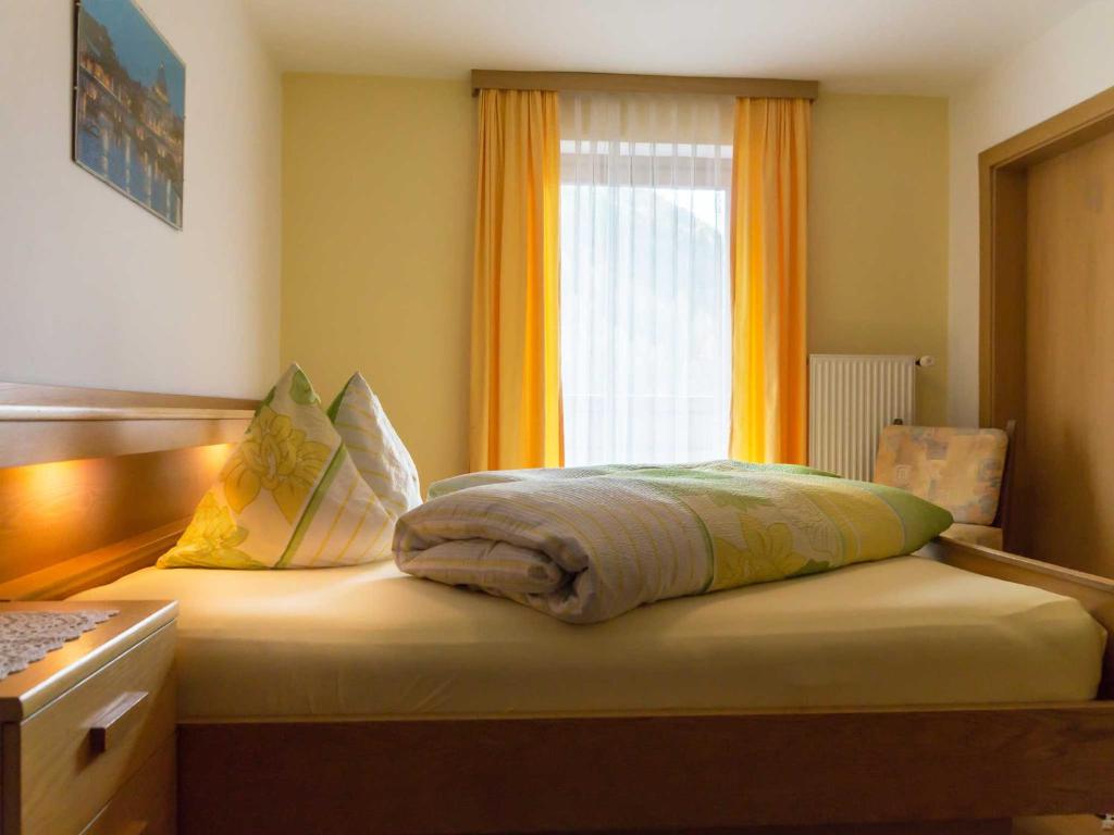 Postel nebo postele na pokoji v ubytování Hotel Alpenfriede