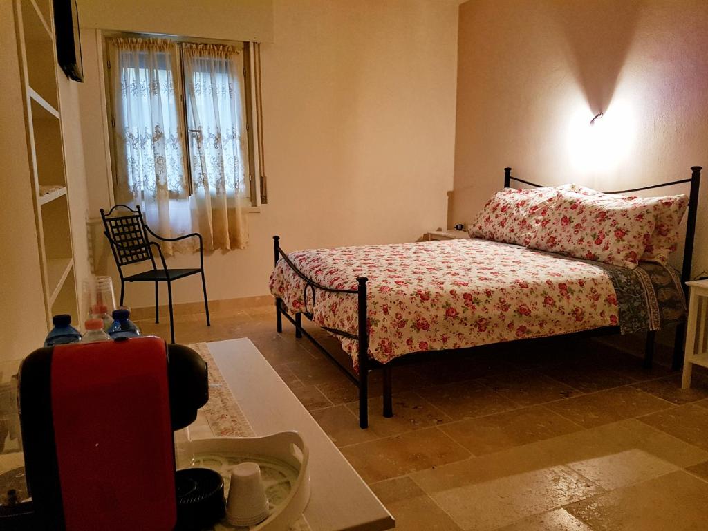 Postel nebo postele na pokoji v ubytování Foresteria Borgo Delle Grazie