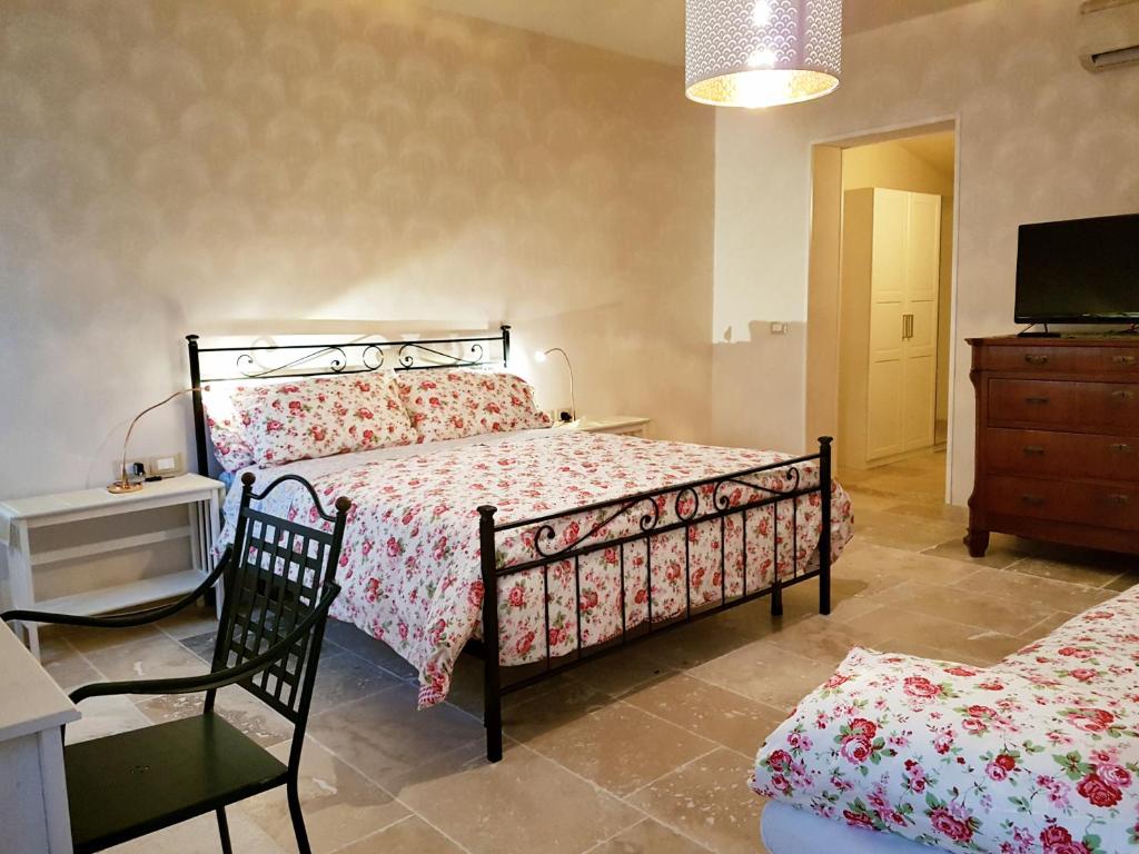 Postel nebo postele na pokoji v ubytování Foresteria Borgo Delle Grazie