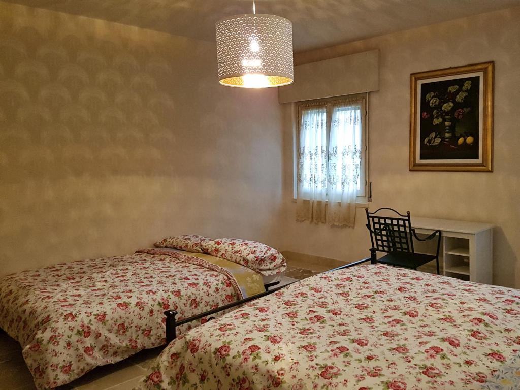 Postel nebo postele na pokoji v ubytování Foresteria Borgo Delle Grazie