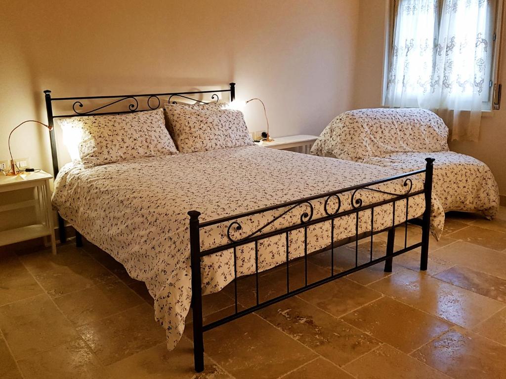 Postel nebo postele na pokoji v ubytování Foresteria Borgo Delle Grazie