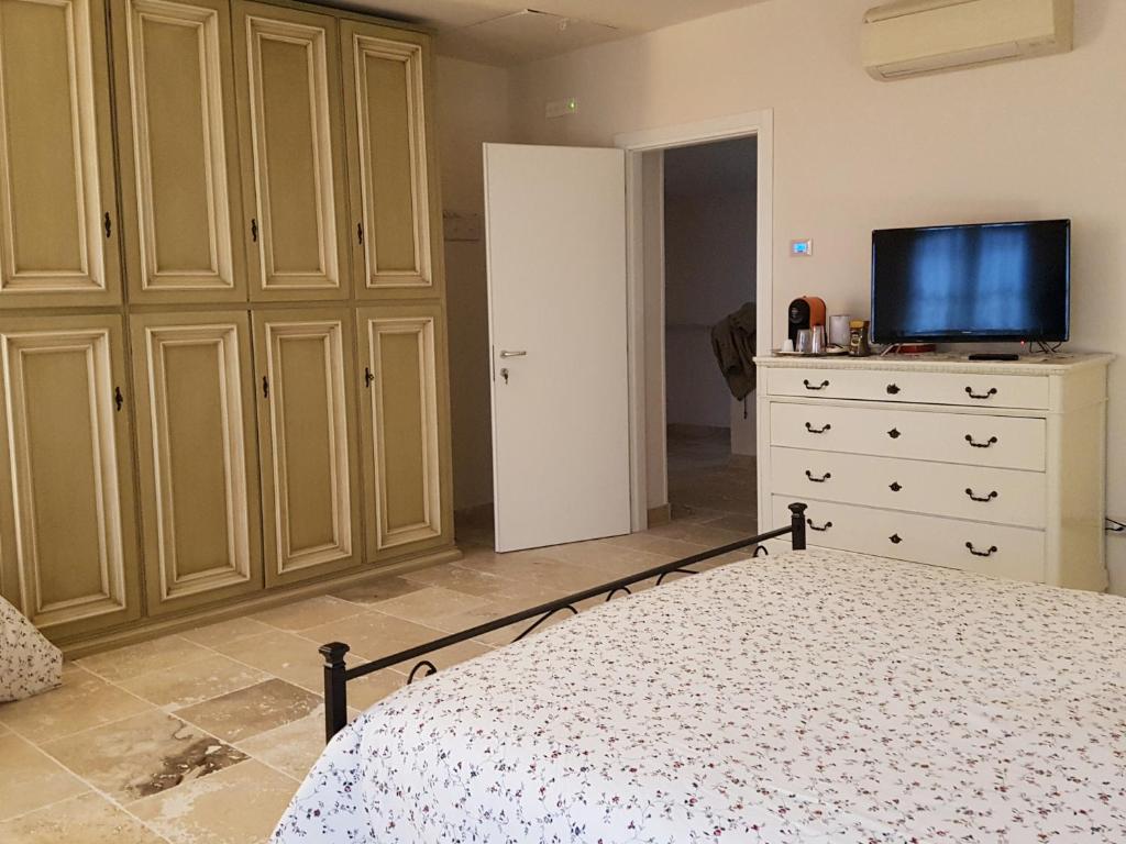 Postel nebo postele na pokoji v ubytování Foresteria Borgo Delle Grazie