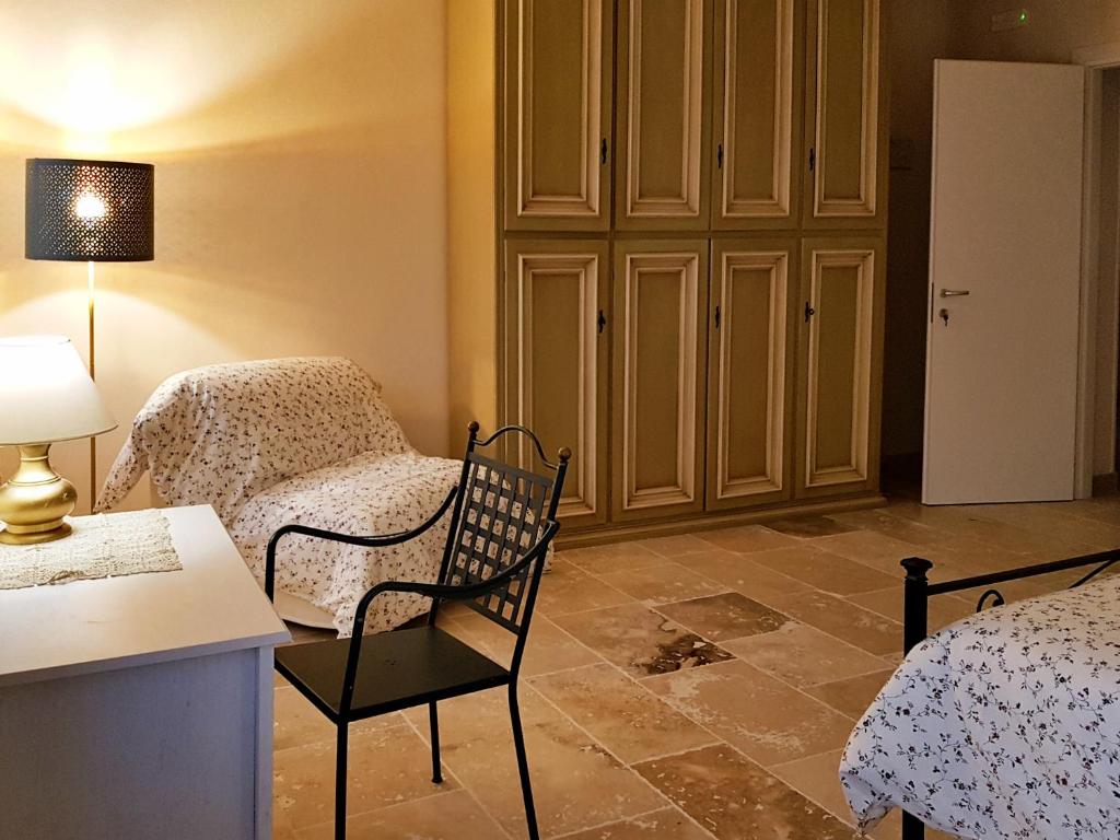 Postel nebo postele na pokoji v ubytování Foresteria Borgo Delle Grazie
