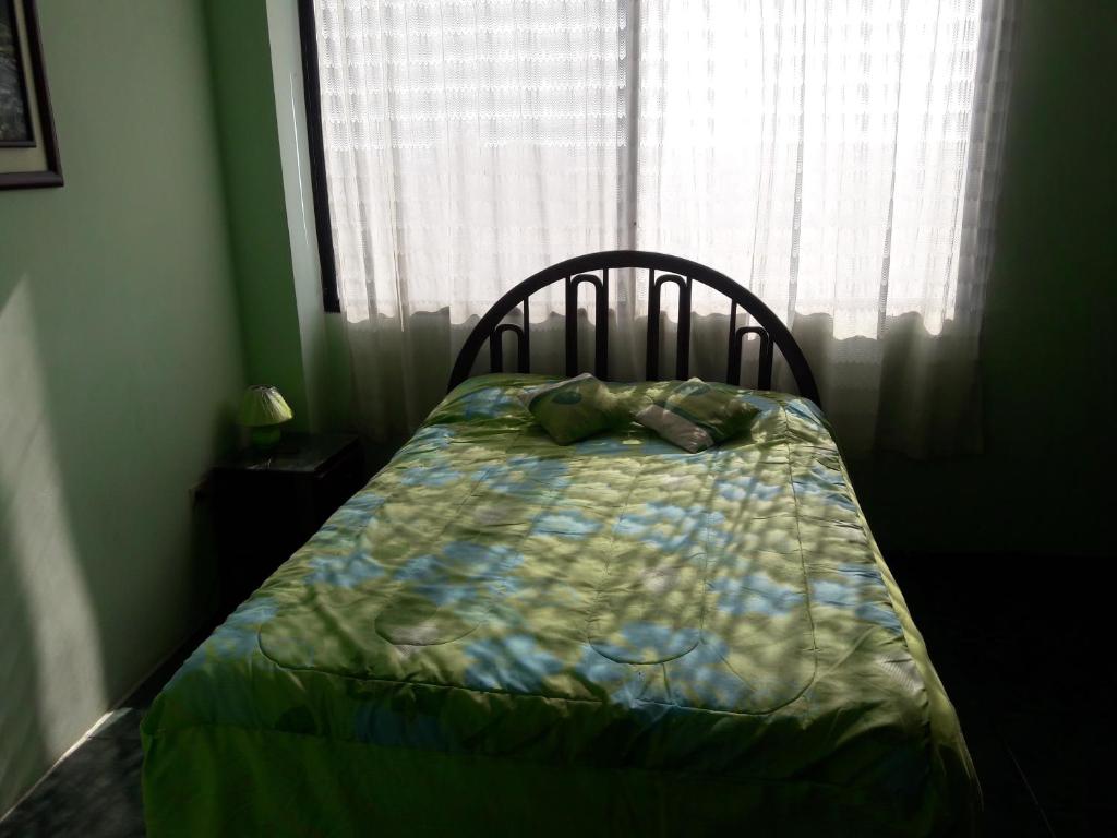 Postel nebo postele na pokoji v ubytování Hostal Haziel