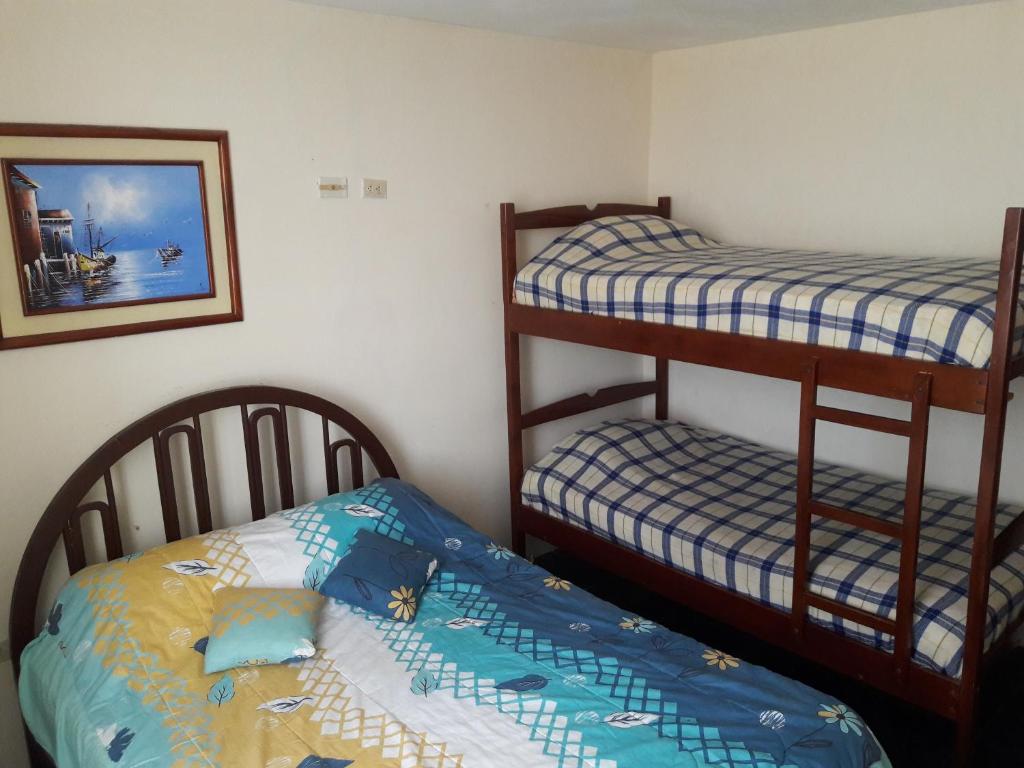 Postel nebo postele na pokoji v ubytování Hostal Haziel