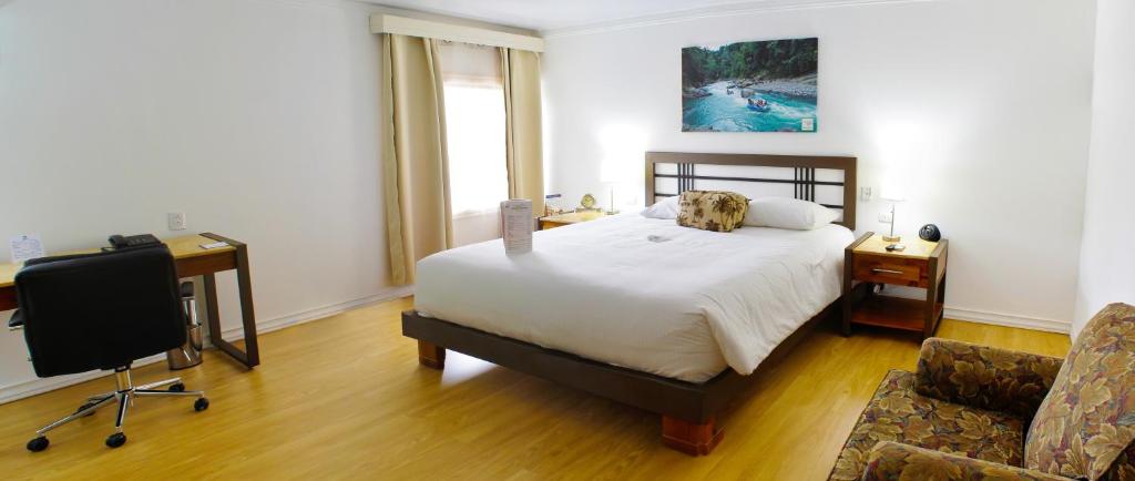 Postel nebo postele na pokoji v ubytování Hotel Zima