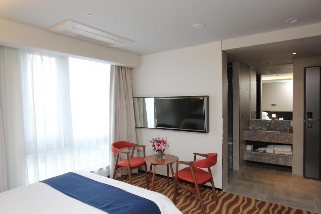 TV a/nebo společenská místnost v ubytování Gloucester Hotel Jeju