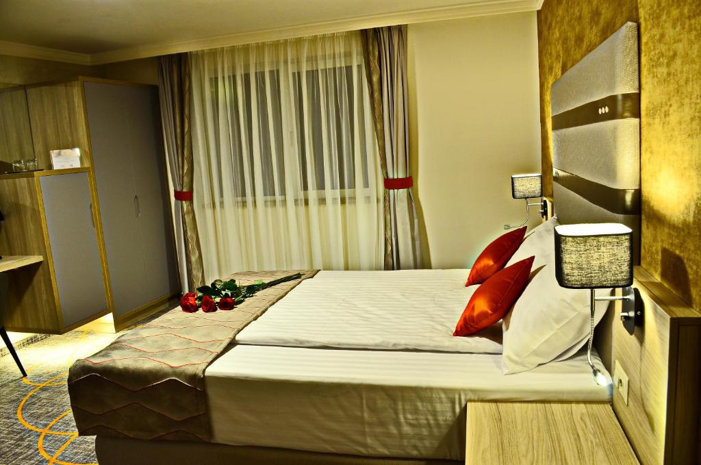 Postel nebo postele na pokoji v ubytování Hotel Baril