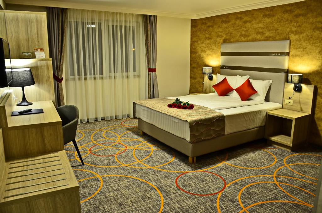 Postel nebo postele na pokoji v ubytování Hotel Baril