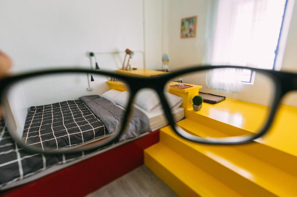 Postel nebo postele na pokoji v ubytování Aekkeko hostel