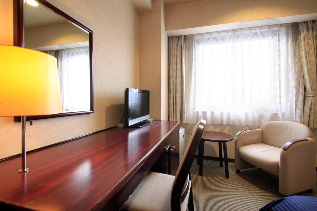 TV a/nebo společenská místnost v ubytování Quintessa Hotel Ogaki