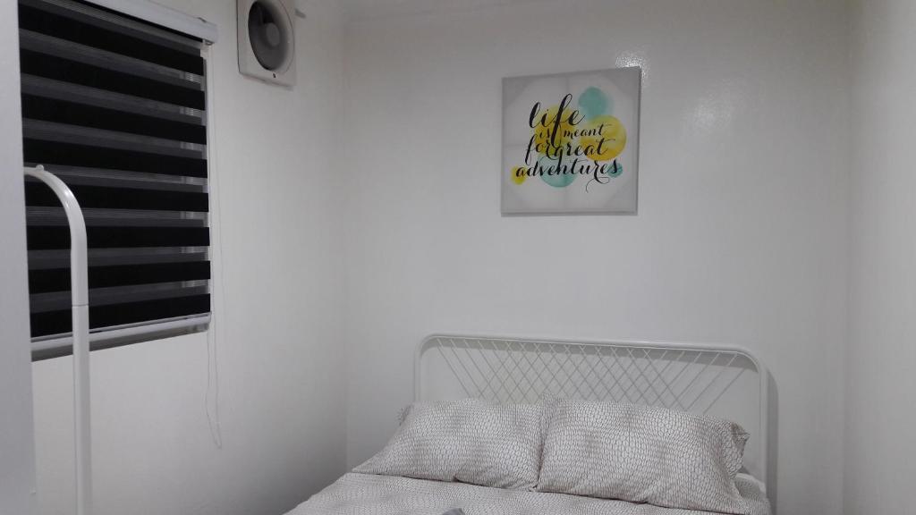 Postel nebo postele na pokoji v ubytování Jeram Tiny House