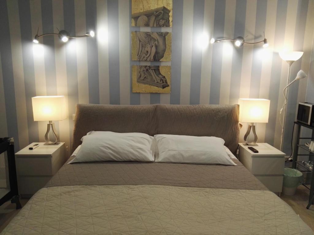 Postel nebo postele na pokoji v ubytování B&B Pescara Centro Luxury Suite