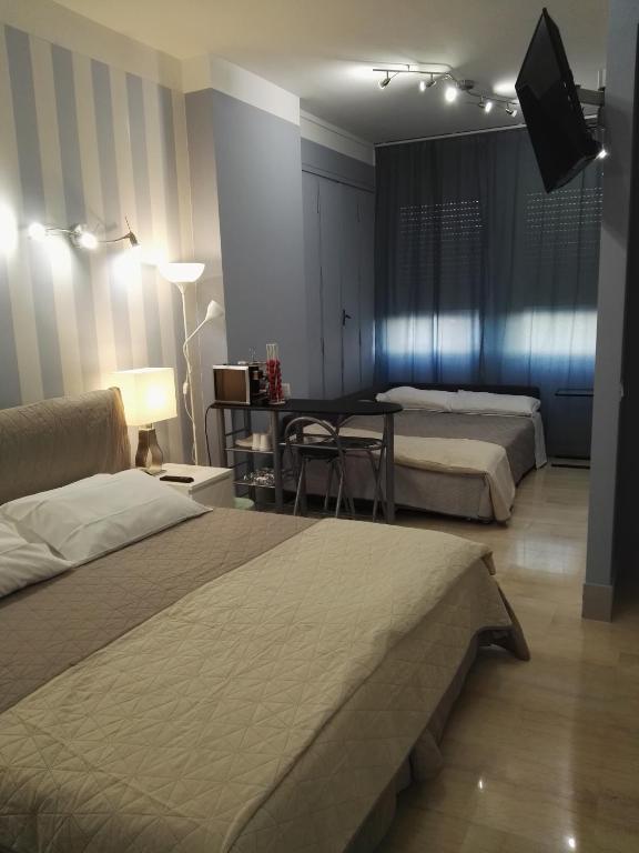 Postel nebo postele na pokoji v ubytování B&B Pescara Centro Luxury Suite