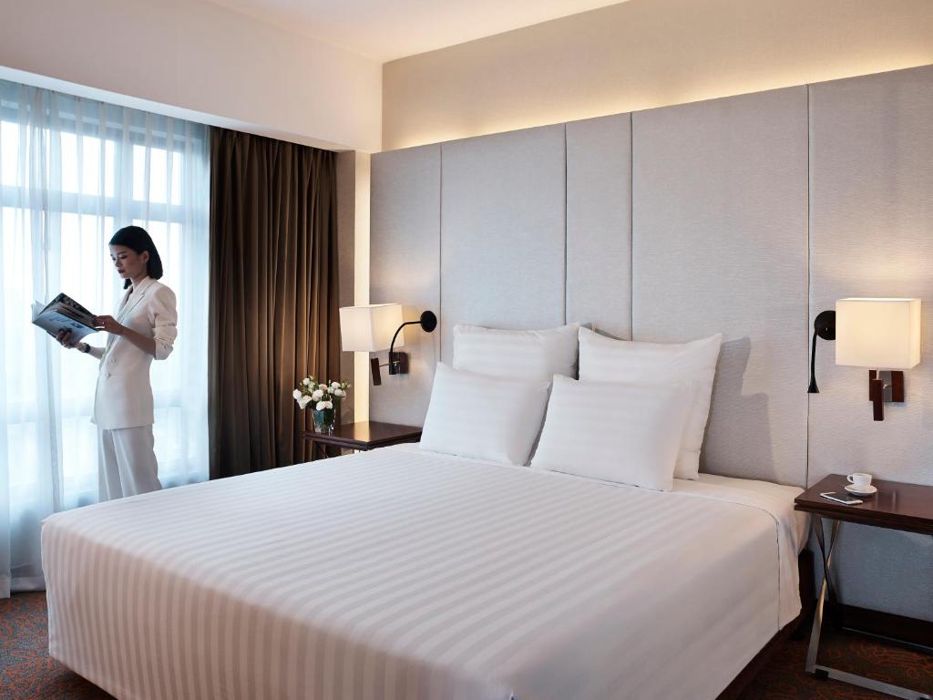 Postel nebo postele na pokoji v ubytování Pullman Hanoi