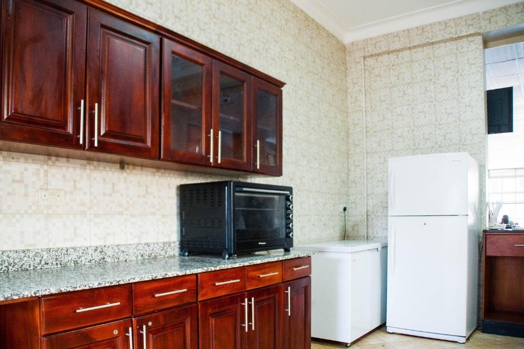 Kuchyň nebo kuchyňský kout v ubytování Kenendia Hotel