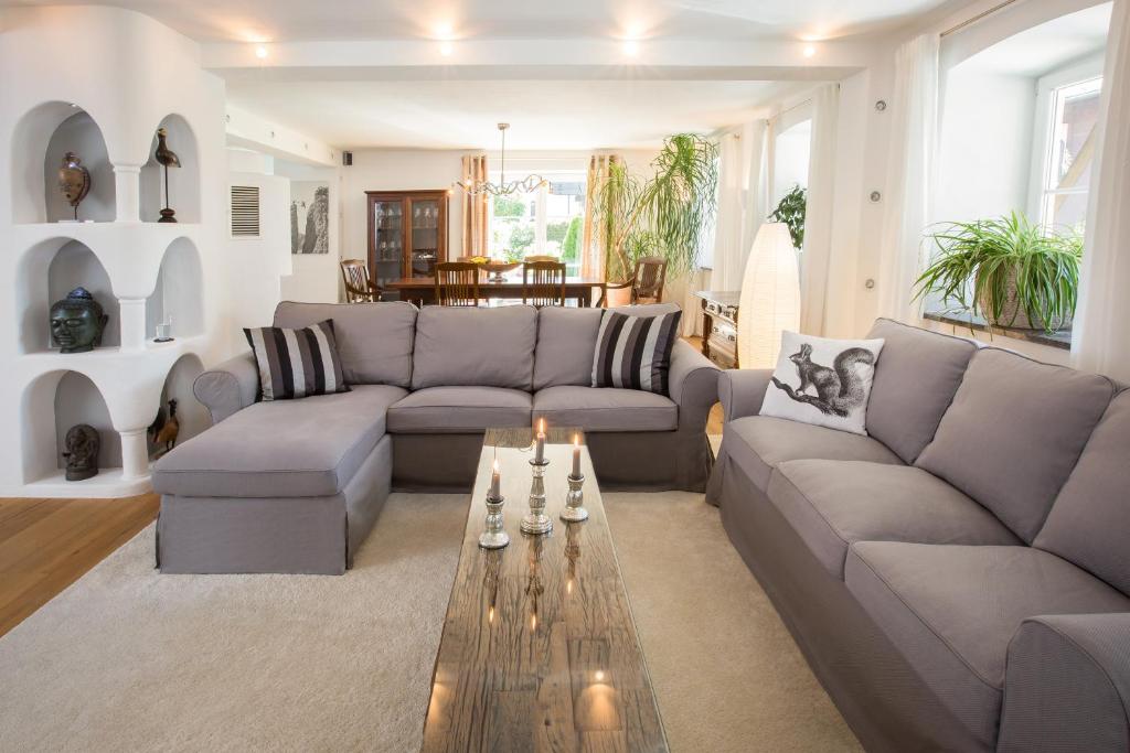 a living room with a couch and a coffee table at Steinbock in Oberstdorf