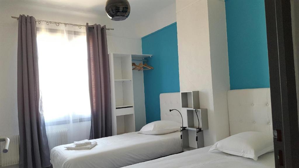 Postel nebo postele na pokoji v ubytování Hôtel l'Etoile