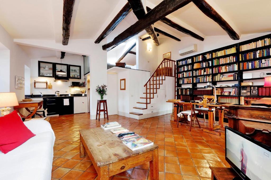 a living room with a couch and a table at Trastevere Charming Loft | Romeloft in Rome