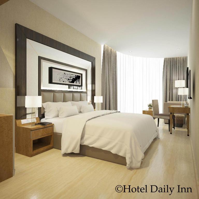 Postel nebo postele na pokoji v ubytování Hotel Daily Inn