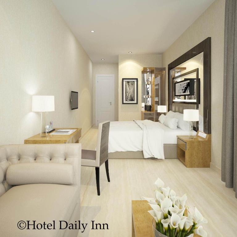 Postel nebo postele na pokoji v ubytování Hotel Daily Inn