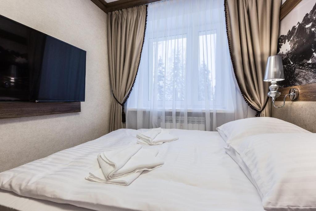 Posteľ alebo postele v izbe v ubytovaní Apartament Helena Odkryj Zakopane