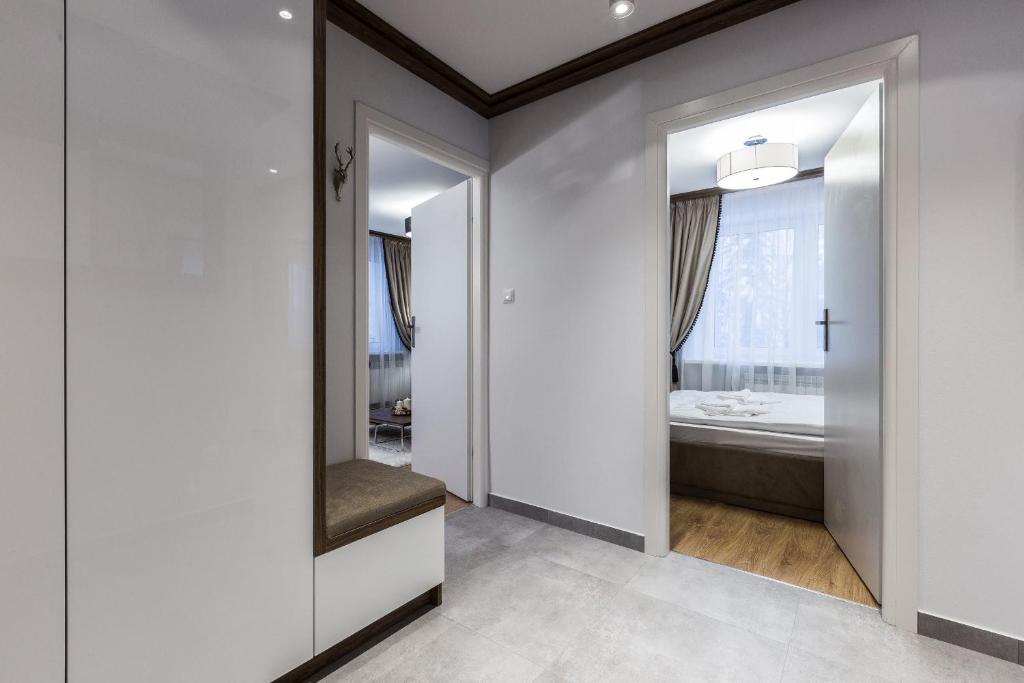 Posteľ alebo postele v izbe v ubytovaní Apartament Helena Odkryj Zakopane