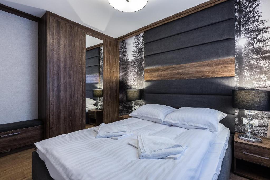 Posteľ alebo postele v izbe v ubytovaní Apartament Helena Odkryj Zakopane