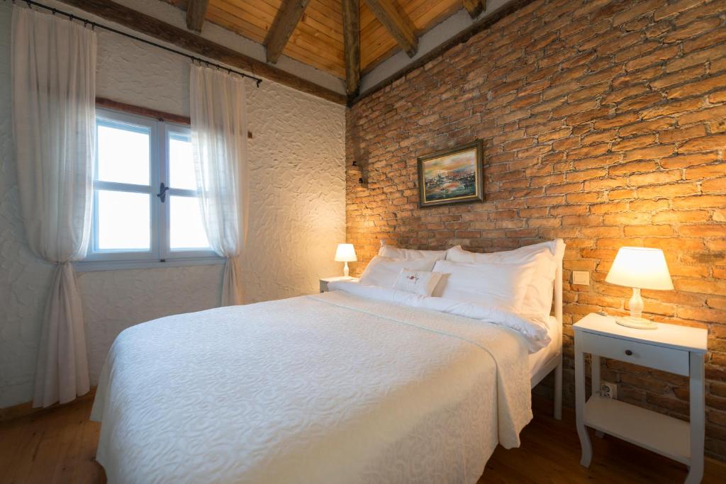 Postel nebo postele na pokoji v ubytování Moy Hotel