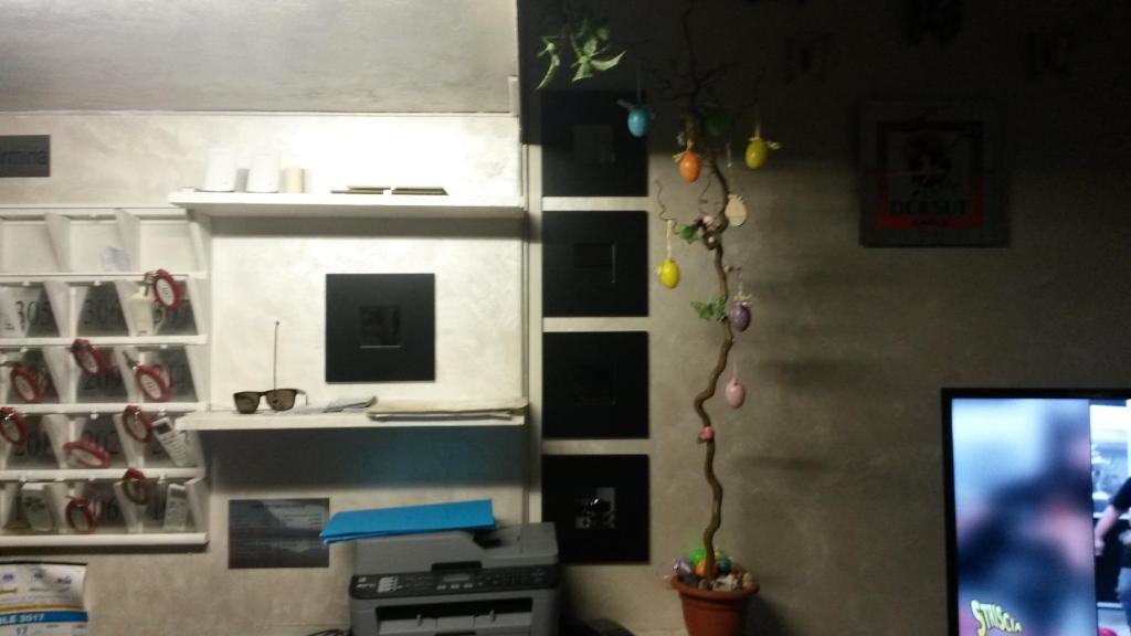Televízia a/alebo spoločenská miestnosť v ubytovaní Hotel Taormina