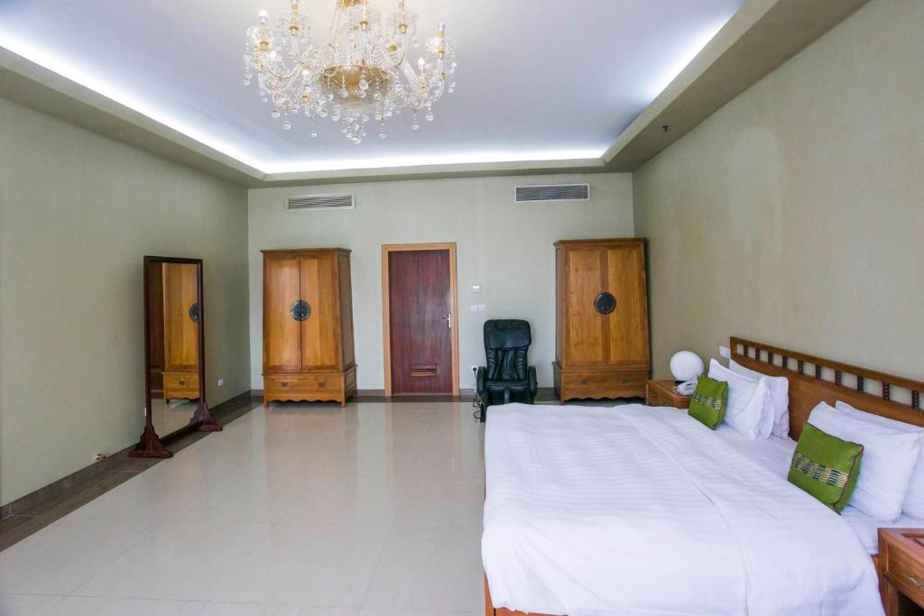 Rúm í herbergi á Lagos Oriental Hotel