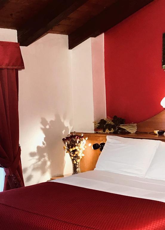 Postel nebo postele na pokoji v ubytování Hotel & Restaurant Le Charaban