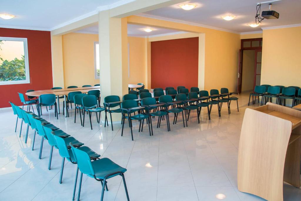 a conference room with chairs and tables in it at Saint Catherine Hotel in Pythagoreio